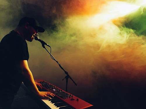 human man playing piano music