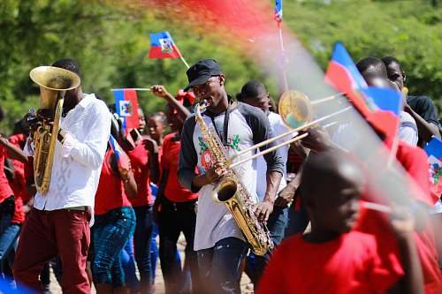 human man playing wind instrument people