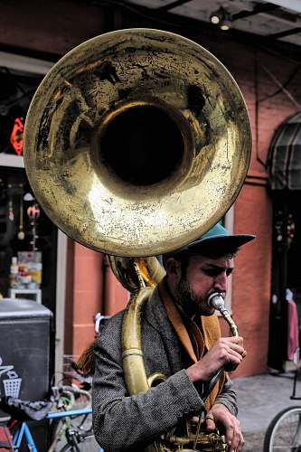 human man plying trombone people
