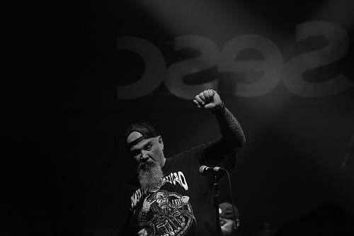 human man raising his right hand black-and-white