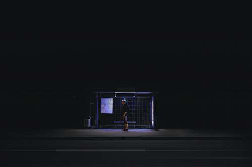 valmiera man waiting on shed during nightime latvia