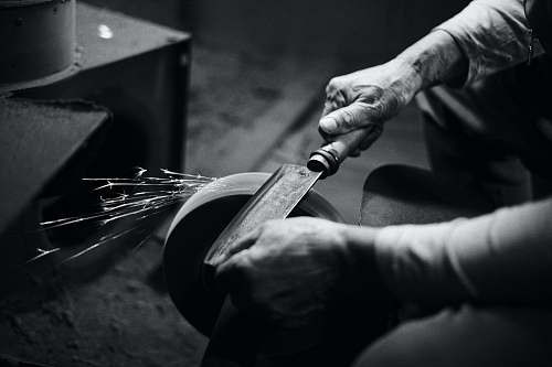 human person grinding cleaver black-and-white