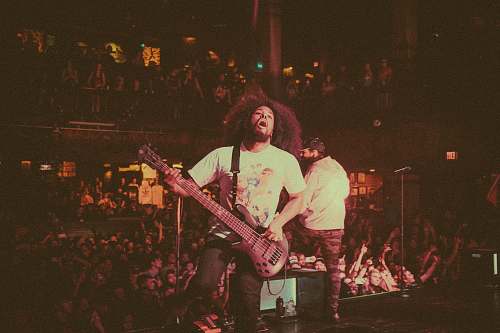 human person playing electric guitar people
