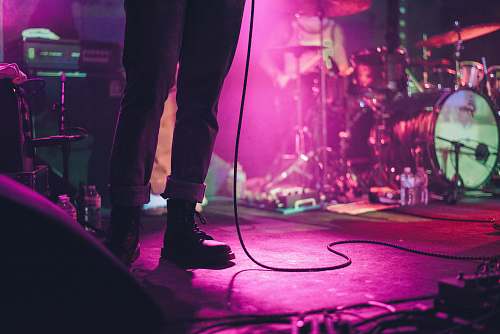 human person standing on stage crowd