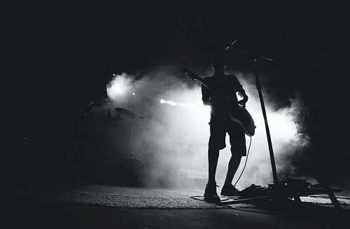 human silhouette photo of guitarist black-and-white