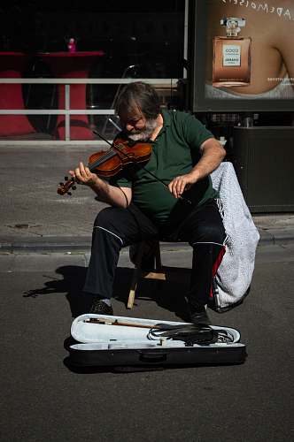 human unknown person playing brown violin outdoors kortrijk