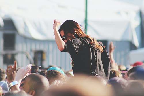 human woman on top of crowd people