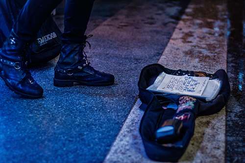 footwear two black bags on pedestrian lane clothing
