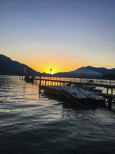 waterfront boat beside dock pier