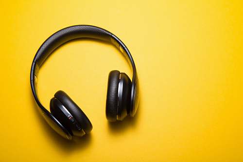 music flatlay photography of wireless headphones headphones