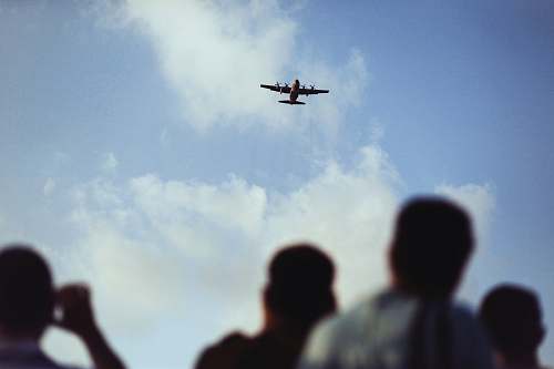 people airplane flying above the sky aircraft