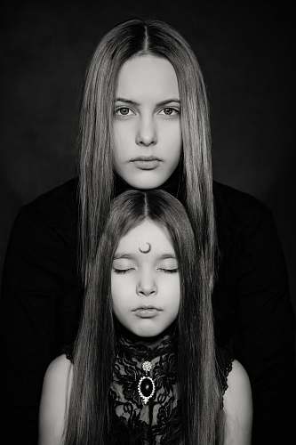 person grayscale photography of two women people