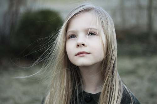 people close-up photography of girl in black top during daytime kid