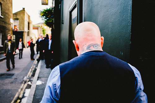 person blue and black suit attire eye