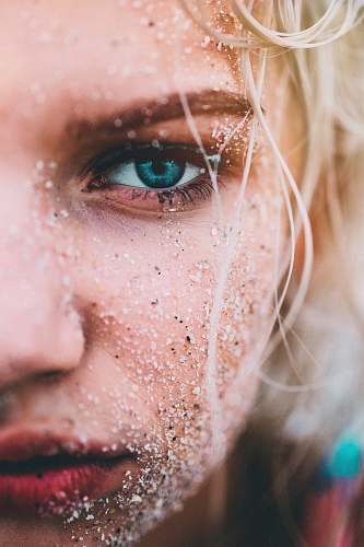 human closeup view of woman with green eyes face
