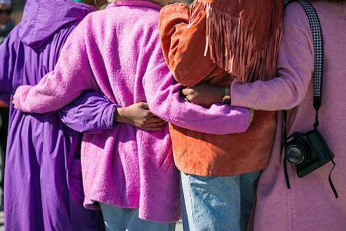 person four person holding each others waist at daytime human