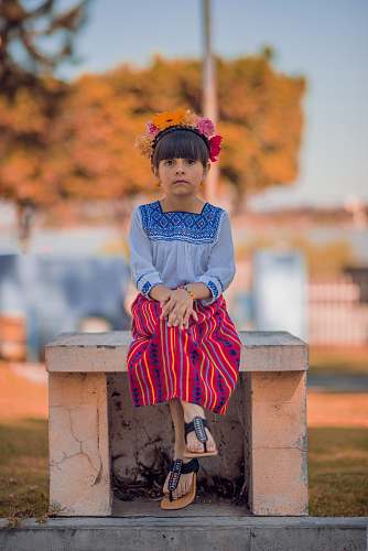 kid girl sitting on bench girl