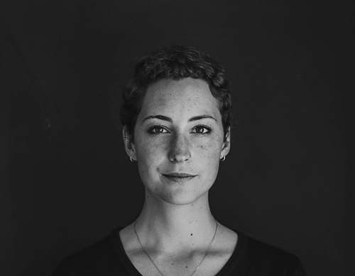black-and-white grayscale photo of woman wearing necklace and top portrait