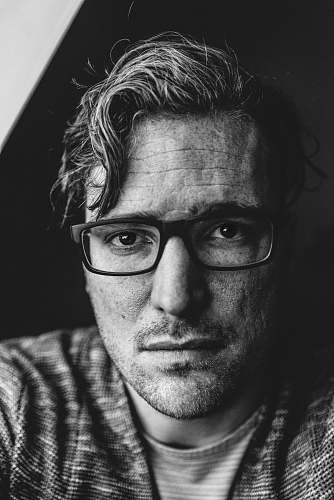 black-and-white grayscale photography of man taking selfie portrait