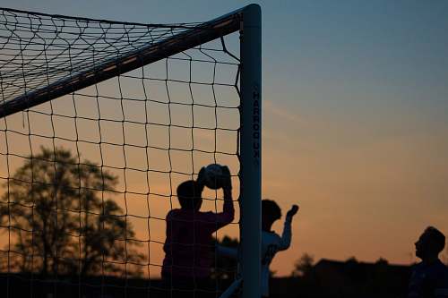 human group of men playing soccer person