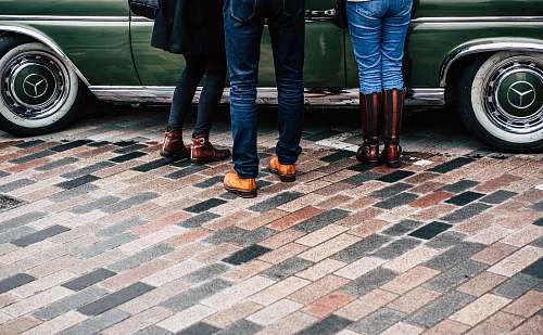 person group of people standing on tiled surface car