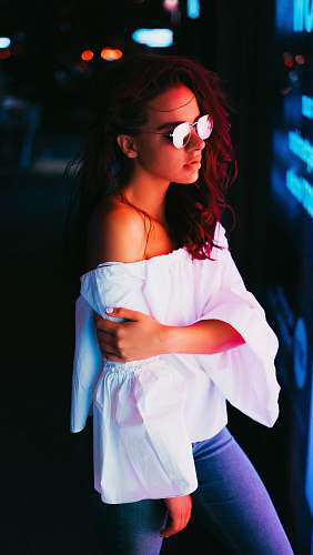 person low light photography woman wearing white off-shoulder top human