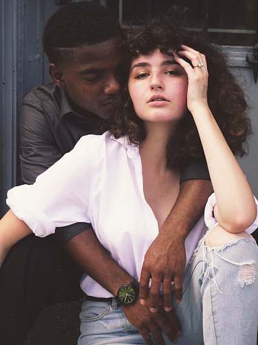 couple man hugging woman while taking photo of each other diversity