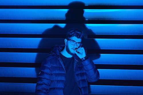 person man smoking standing near wall human
