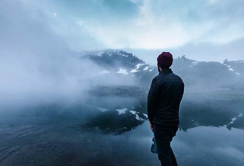person man standing near body of water human