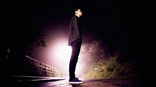 person man standing on road man