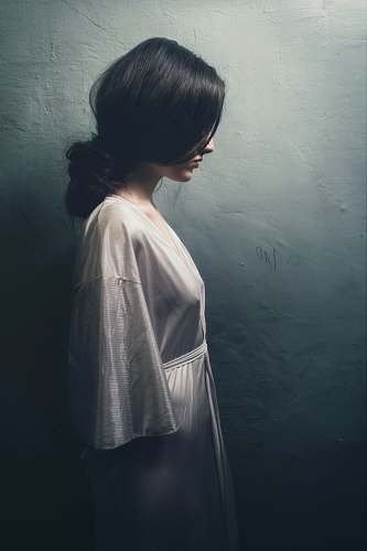 grey painting of woman in white long-sleeved dress woman
