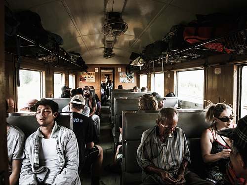 person people sitting inside train human