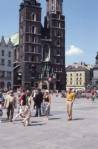 crowd people standing beside concrete cathedral architecture
