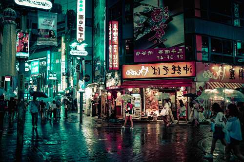 japan people walking near buildings at night city