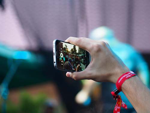person person using black smartphone phone