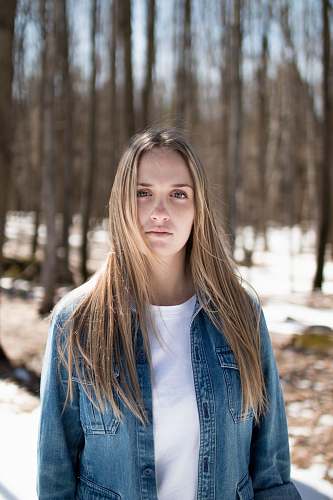 woman photo of a women wearing washed denim jacket portrait