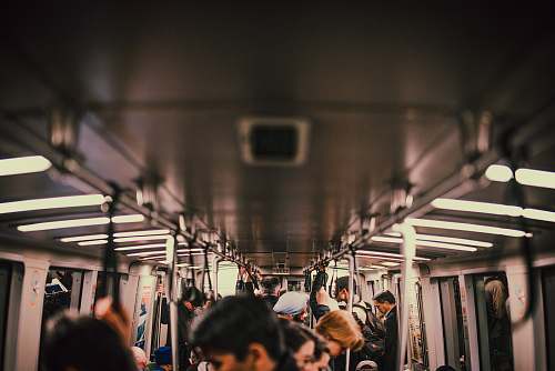 subway photo of people in train underground