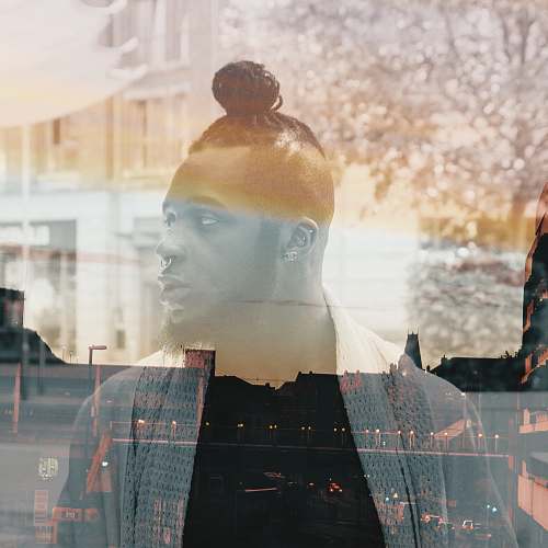 person sepia photography of man in city double exposure