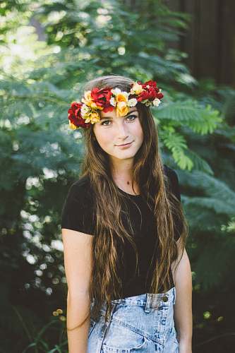 person shallow focus photo of woman wearing floral headband human
