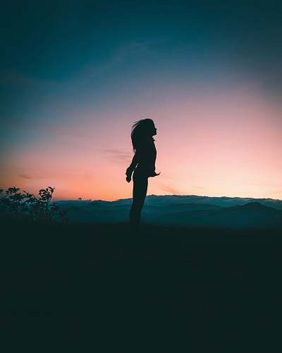 human silhouette of woman jumping silhouette