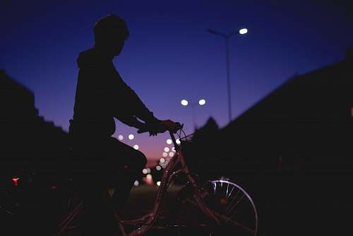 bicycle silhouette person riding on bike at night bike