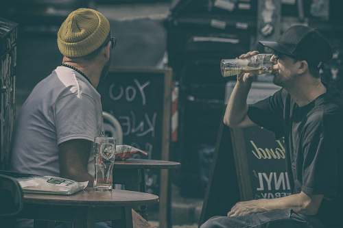 person two men drinking beers human