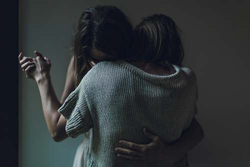 human two women hugging each other woman