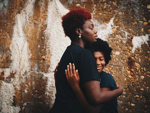 person two women hugging each other family