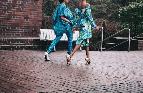 woman two women in teal romper pants fashion