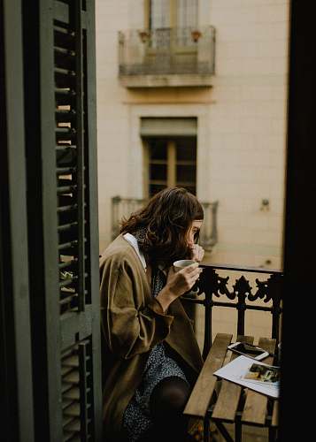 human woman drinking white sitting on bench person