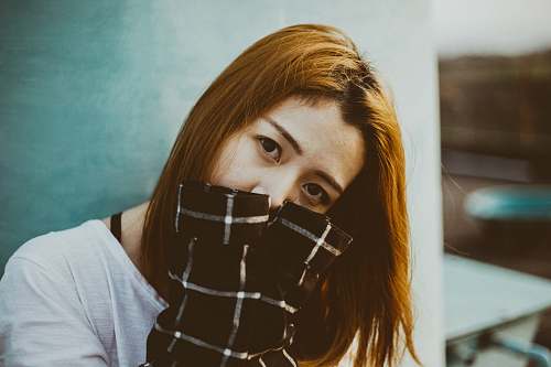 person woman hiding her mouth with her hands human
