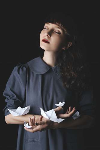 human woman holding paper boat person