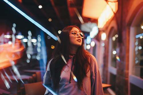 person woman in jacket looking at building human