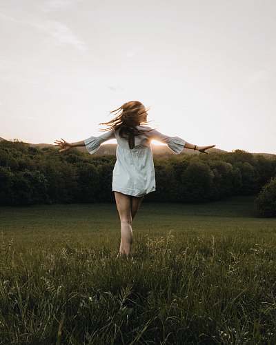 person woman open arm on grass human